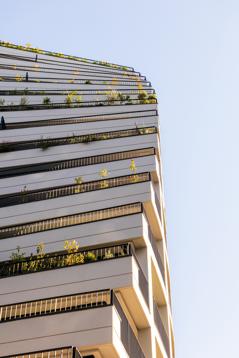 JA joubert architecture sculpts undulating lakefront district following sloped terrain in tirana