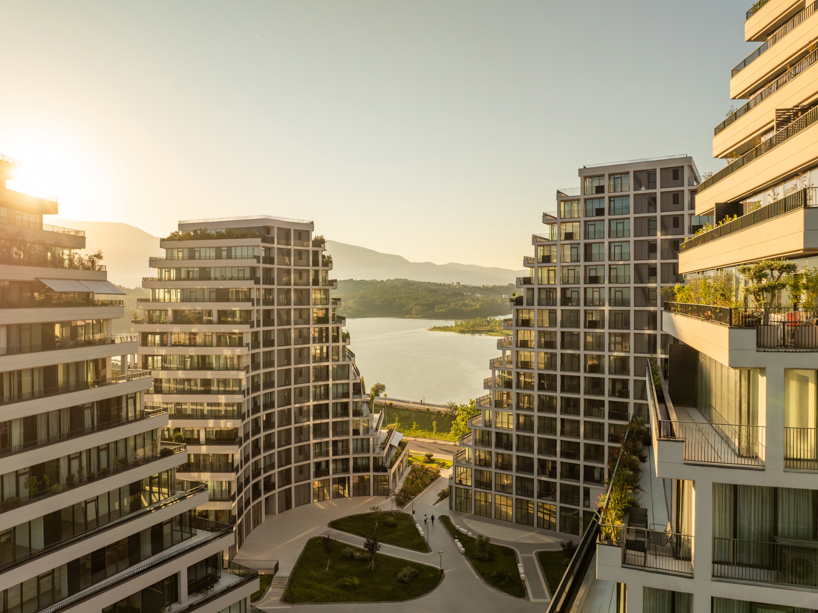 JA joubert architecture sculpts undulating lakefront district following sloped terrain in tirana