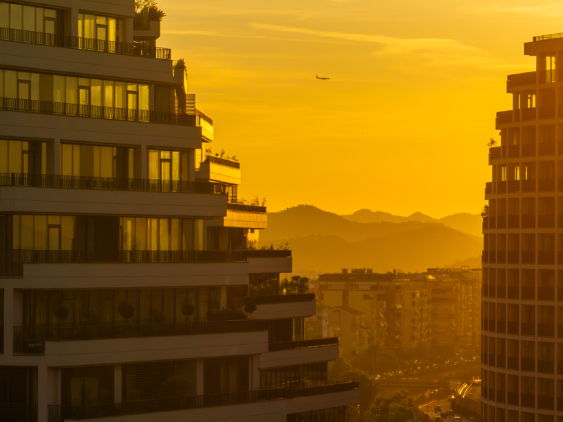 JA joubert architecture sculpts undulating lakefront district following sloped terrain in tirana
