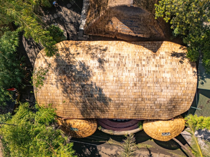 arched bamboo roof shades learning space in bali co-designed by students and mizzi studio