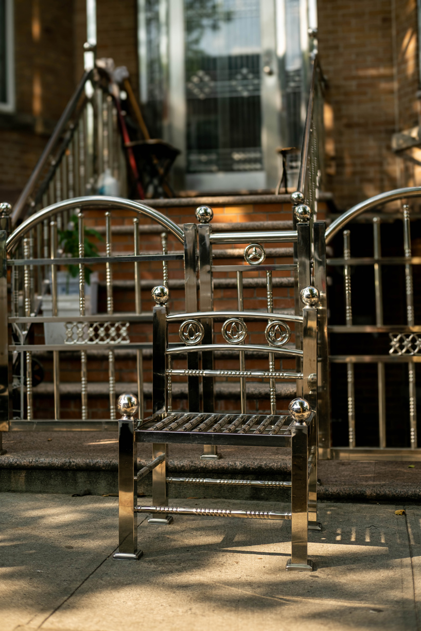 assembled from steel fence components, white picket chair challenges the american dream - 4