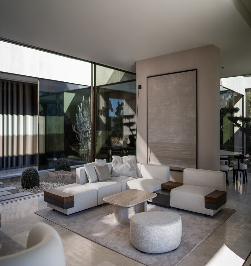 ARK architects elevates villa tai on stone podium framing views of mediterranean sea