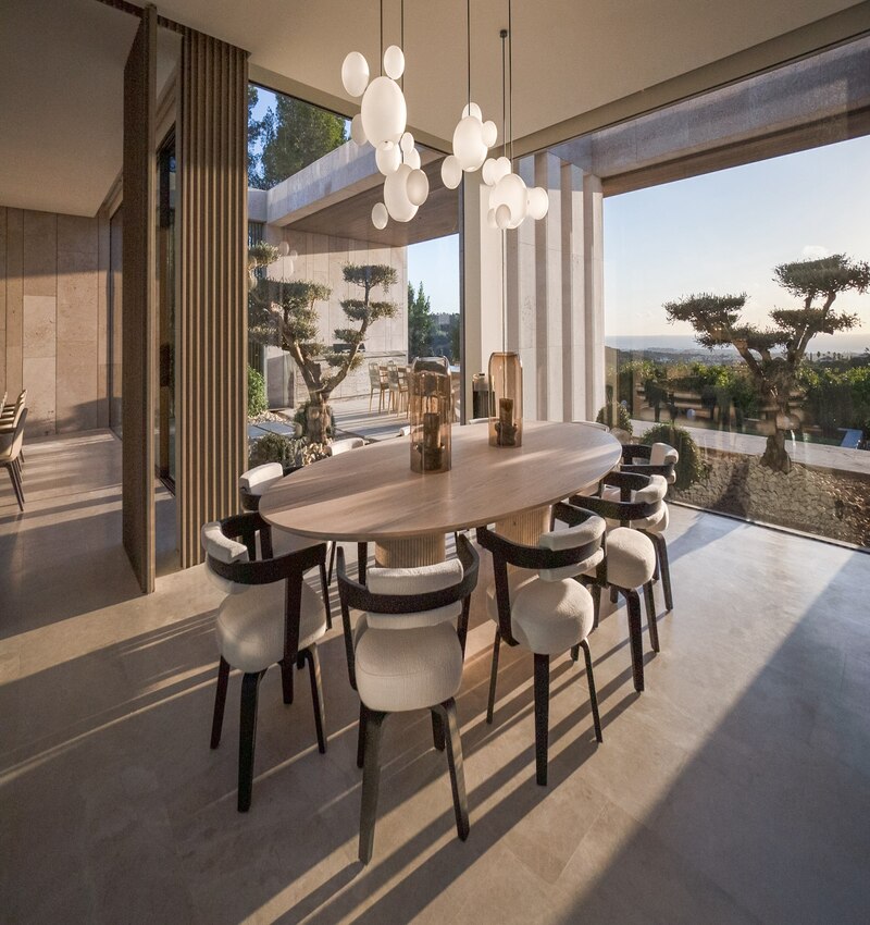 ARK architects elevates villa tai on stone podium framing views of mediterranean sea