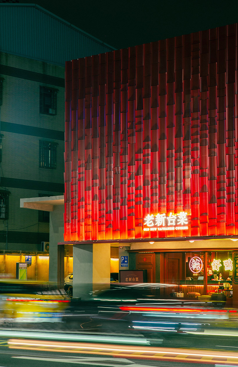 paperfarm reimagines kaohsiung restaurant with rippling red metal facade 10
