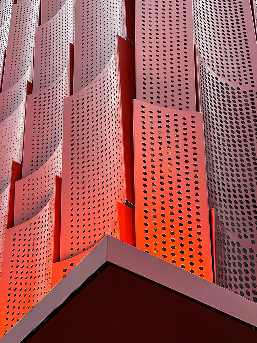 paperfarm reimagines kaohsiung restaurant with rippling red metal facade 11