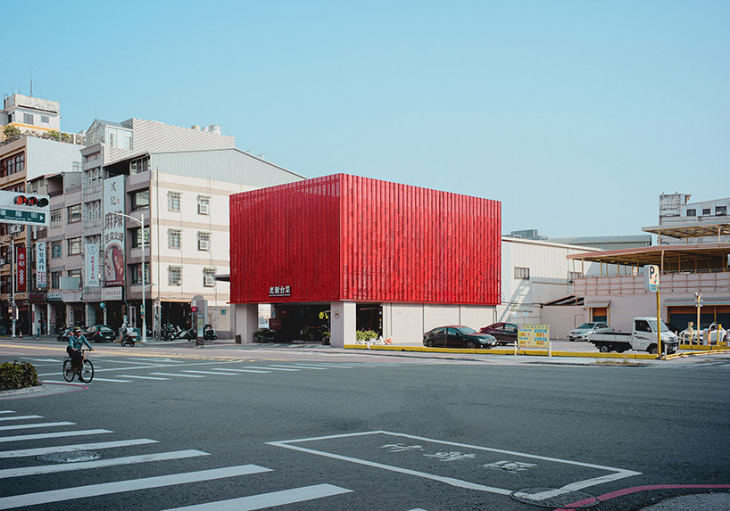paperfarm reimagines kaohsiung restaurant with rippling red metal facade 3