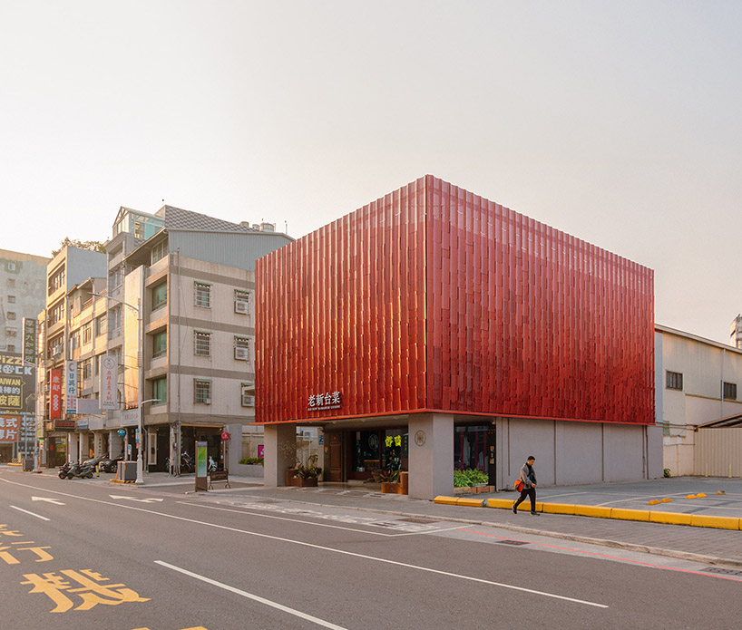 paperfarm reimagines kaohsiung restaurant with rippling red metal facade 4