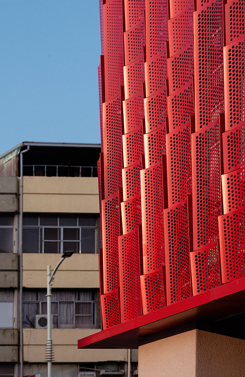 paperfarm reimagines kaohsiung restaurant with rippling red metal facade 5