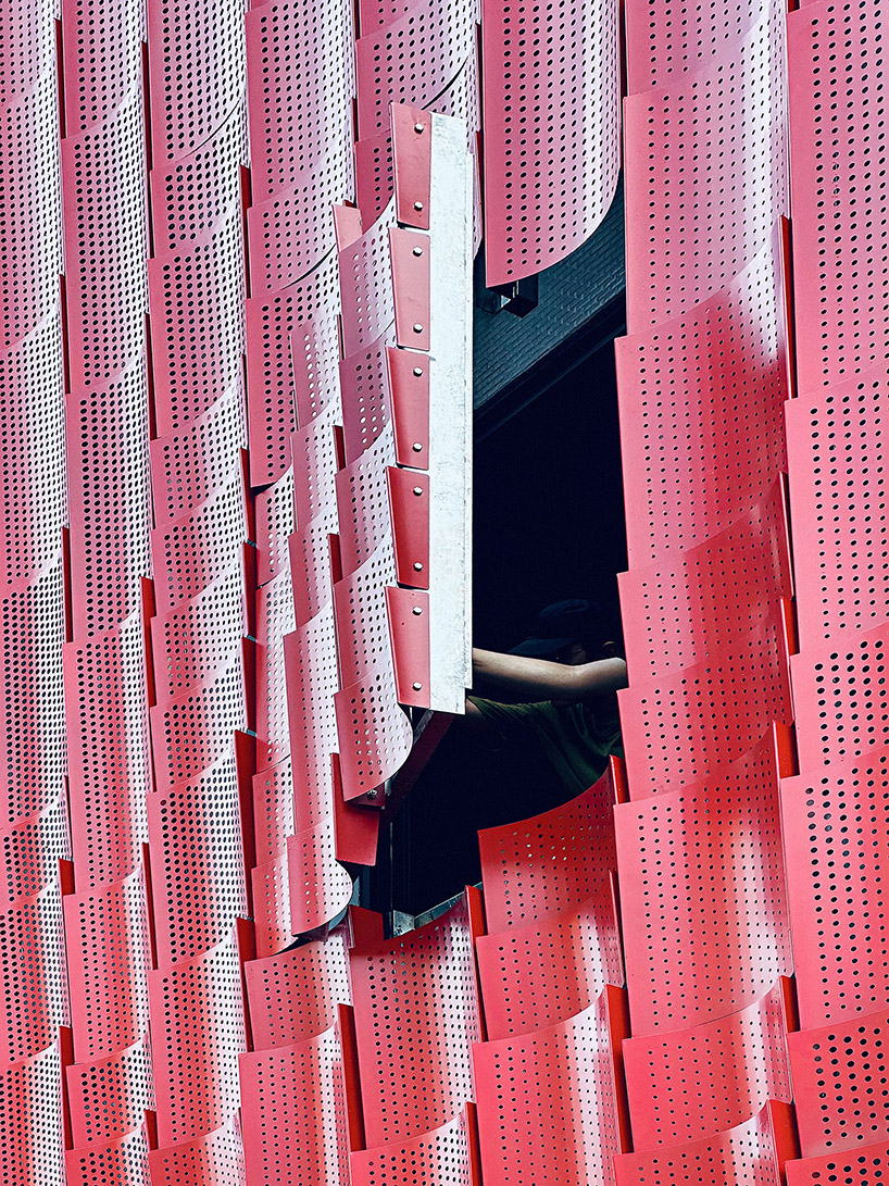 paperfarm reimagines kaohsiung restaurant with rippling red metal facade 7