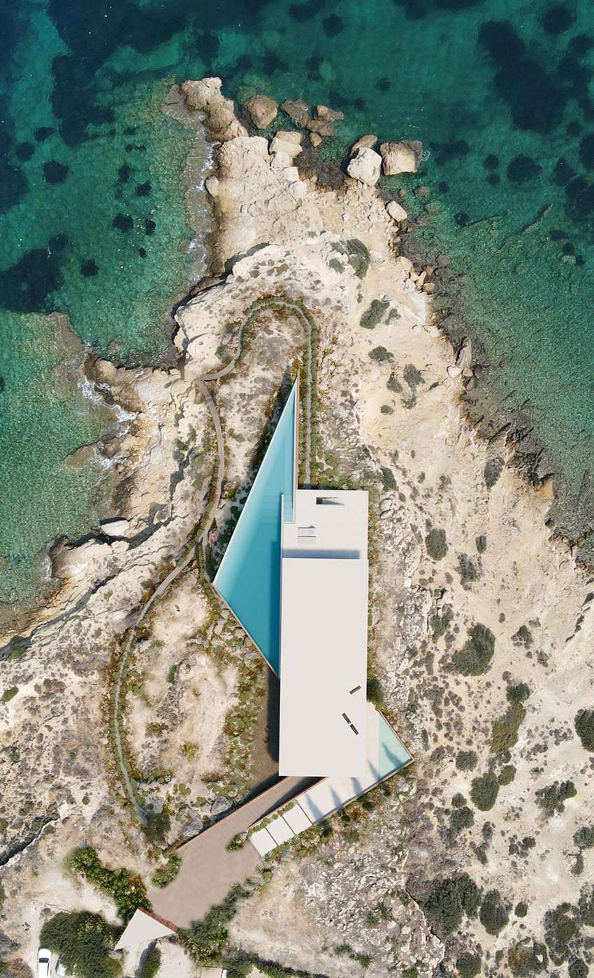 La marcada geometría de la residencia de verano emerge de las laderas costeras griegas