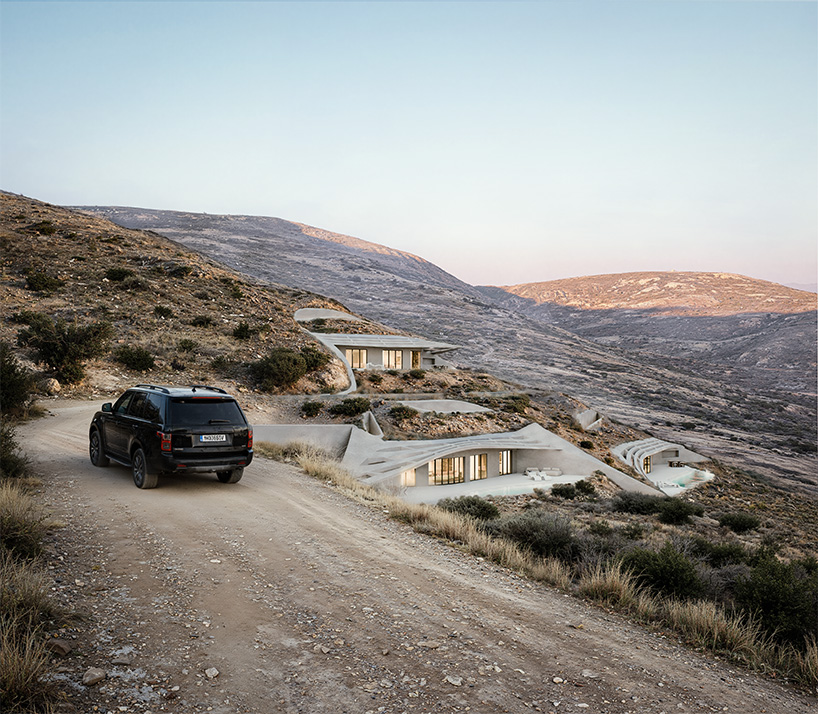 warm-toned concrete forms and planted roofs blend into the cycladic landscape of kythnos - 7