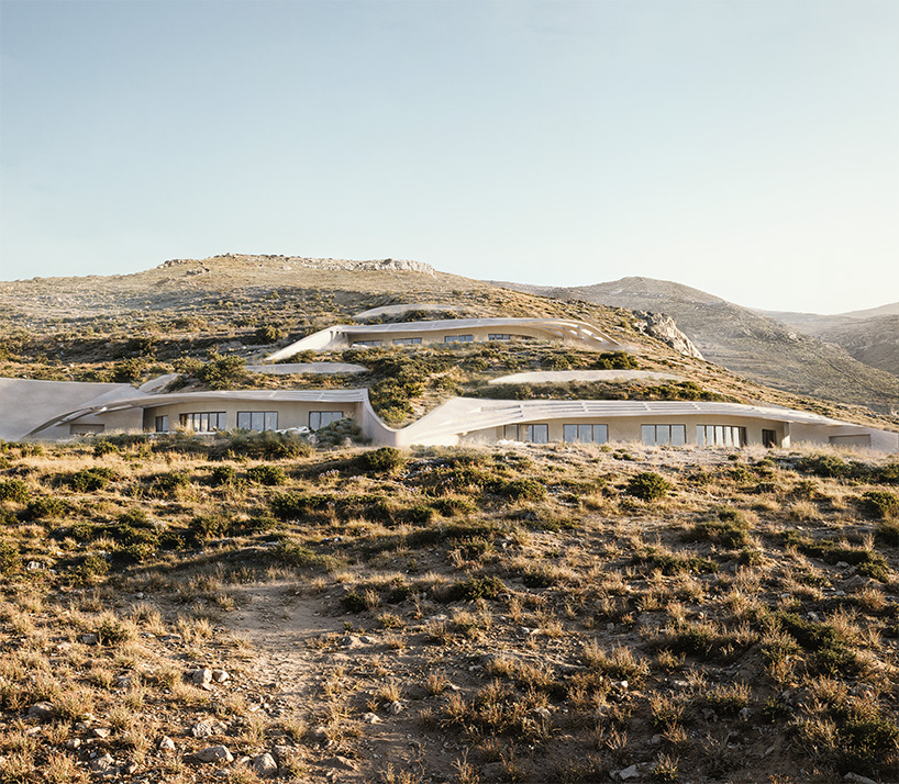warm-toned concrete forms and planted roofs blend into the cycladic landscape of kythnos - 2