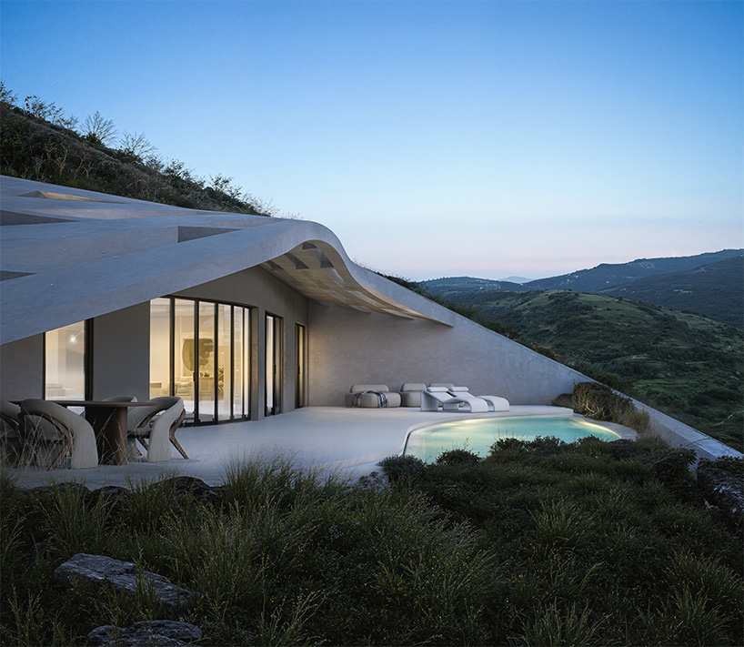 warm-toned concrete forms and planted roofs blend into the cycladic landscape of kythnos - 8