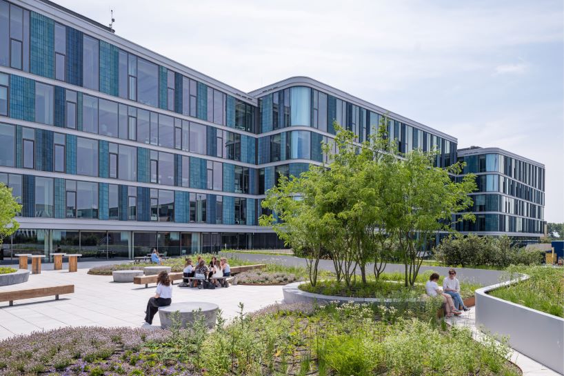 glazed ceramic tiles adorn hybrid timber office building's facade by team v in amsterdam