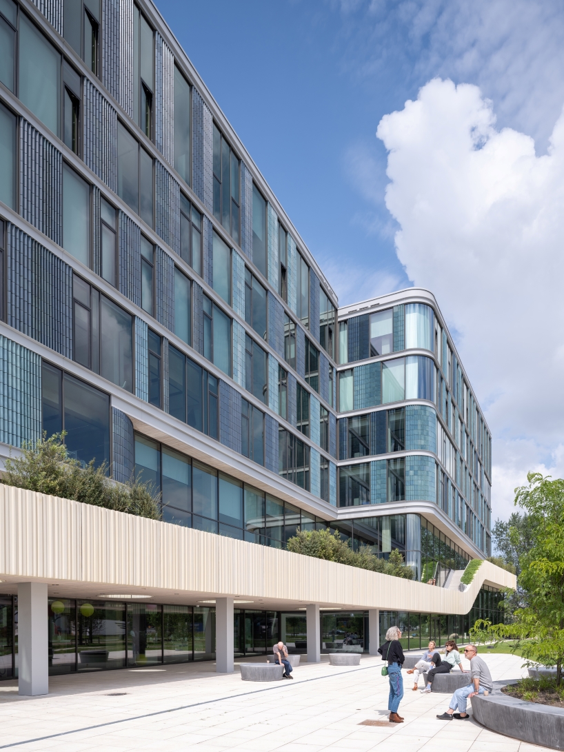 glazed ceramic tiles adorn hybrid timber office building's facade by team v in amsterdam