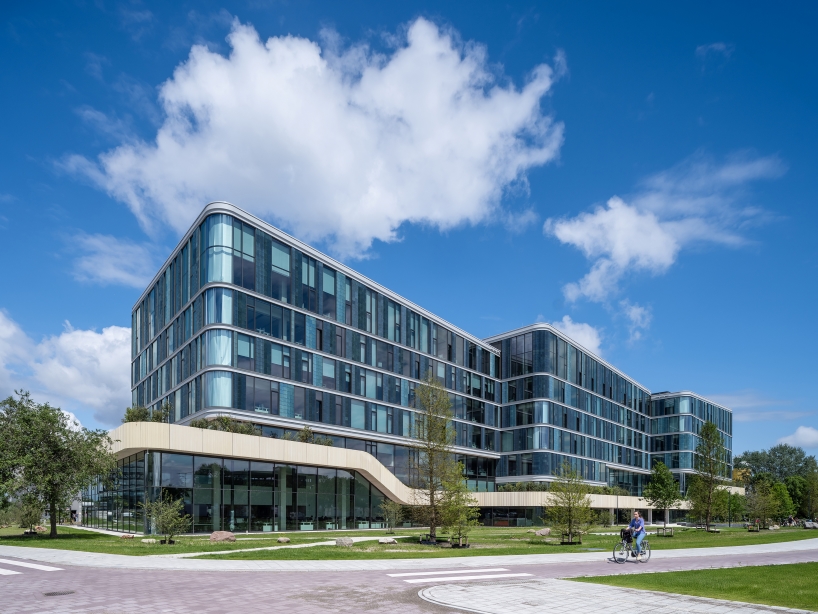 glazed ceramic tiles adorn hybrid timber office building's facade by team v in amsterdam