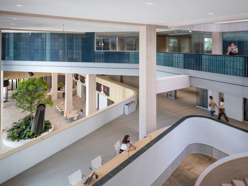 glazed ceramic tiles adorn hybrid timber office building's facade by team v in amsterdam
