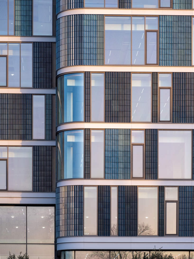 glazed ceramic tiles adorn hybrid timber office building's facade by team v in amsterdam