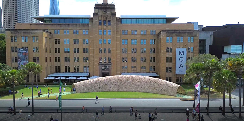 thousands of hand-split bamboo strands weave curved tunnel by cave urban in sydney