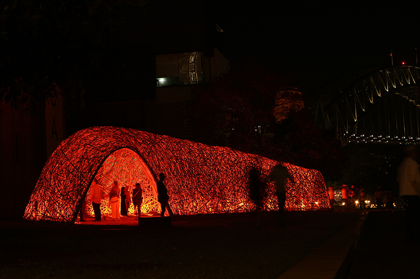 thousands of hand-split bamboo strands weave curved tunnel by cave urban in sydney