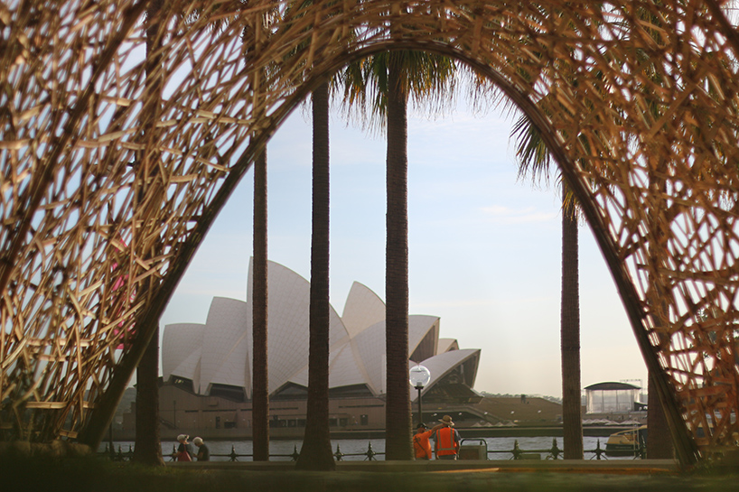 thousands of hand-split bamboo strands weave curved tunnel by cave urban in sydney