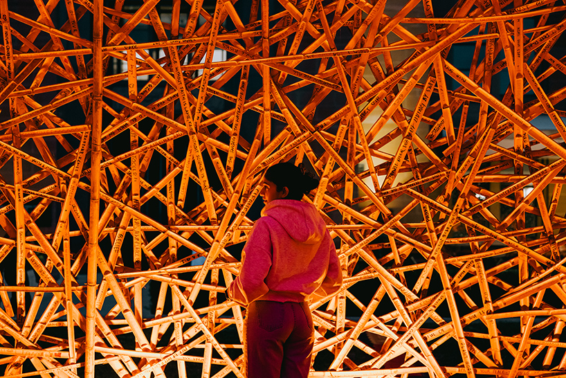 thousands of hand-split bamboo strands weave curved tunnel by cave urban in sydney