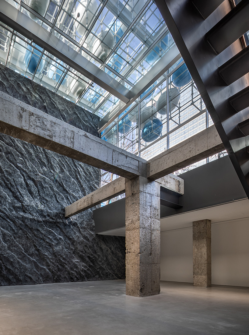 vibrant balloons nestle within metallic scaffolding atop seoul's playful urban hub by SSP