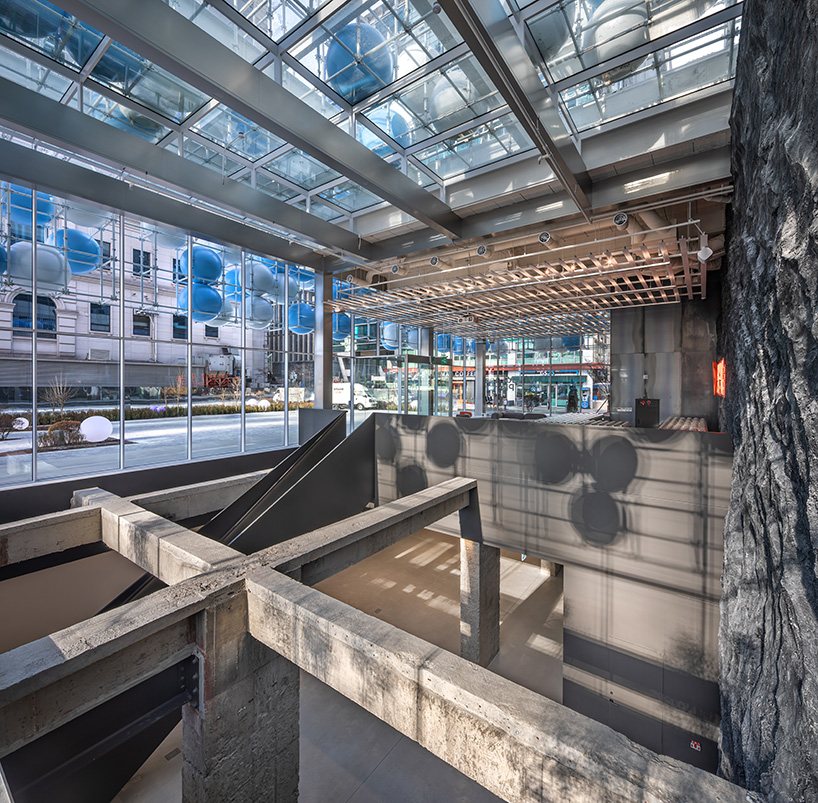 vibrant balloons nestle within metallic scaffolding atop seoul's playful urban hub by SSP