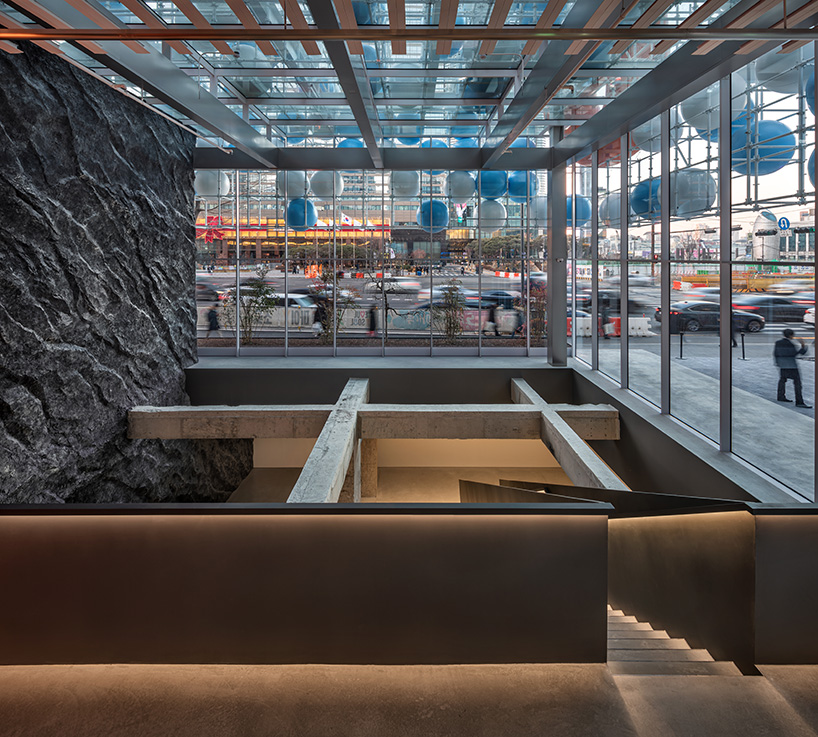 vibrant balloons nestle within metallic scaffolding atop seoul's playful urban hub by SSP