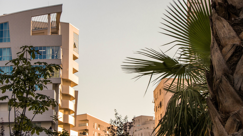 studio libeskind & kontakt weave public gardens through curved residences in tirana