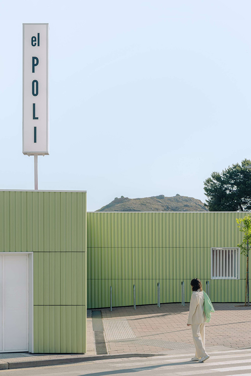 ribbed lime-green gateway and blue solar canopy reform municipal sports center in spain - 2