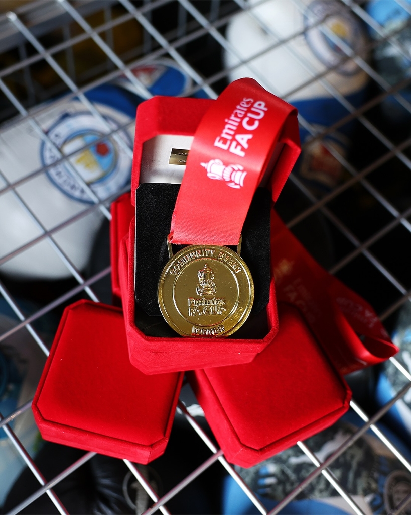 fans' inscriptions cover nigel VMU's six-foot sculptural cup trophy replicas for FA cup final