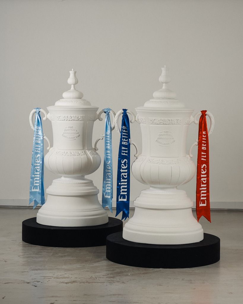 fans' inscriptions cover nigel VMU's six-foot sculptural cup trophy replicas for FA cup final