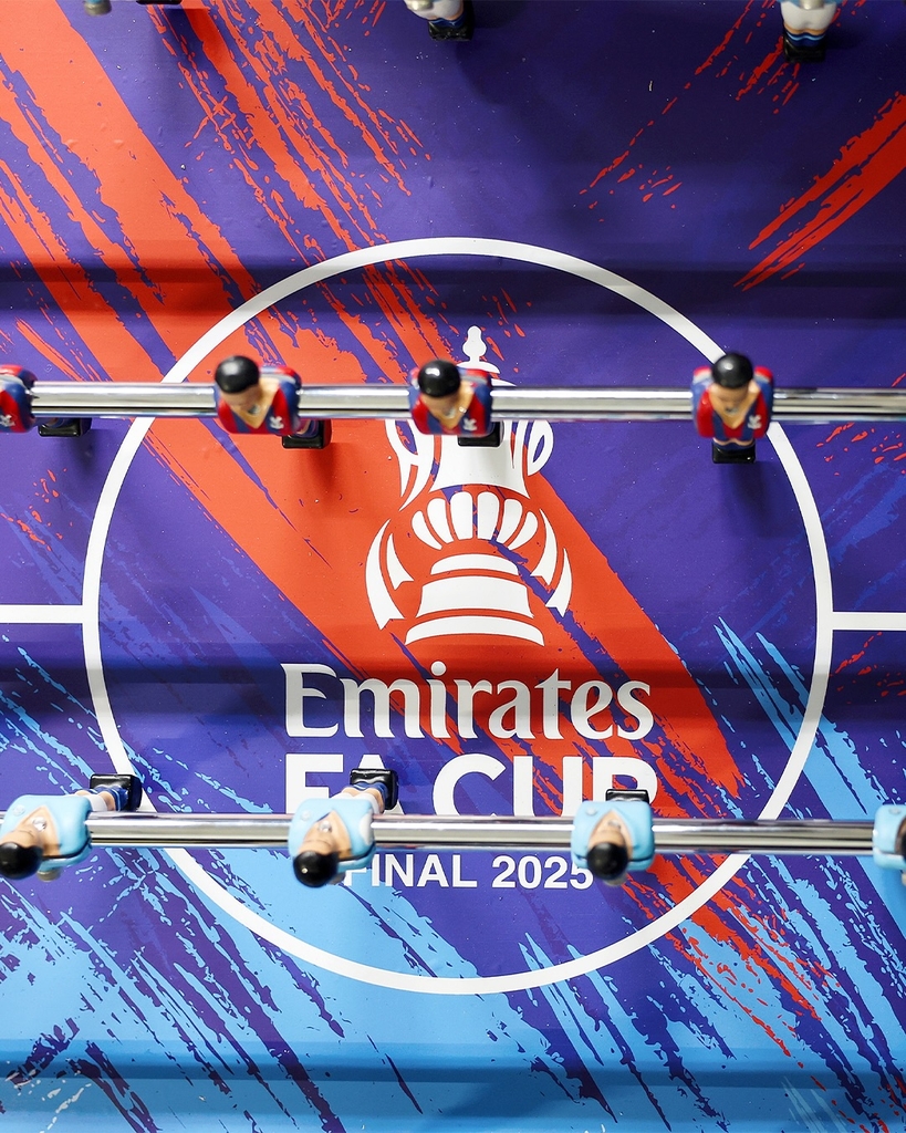 fans' inscriptions cover nigel VMU's six-foot sculptural cup trophy replicas for FA cup final