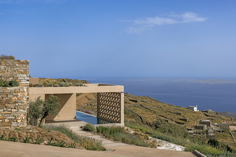 katerina valsamaki embeds subterranean house into hillside slot on tinos island, greece