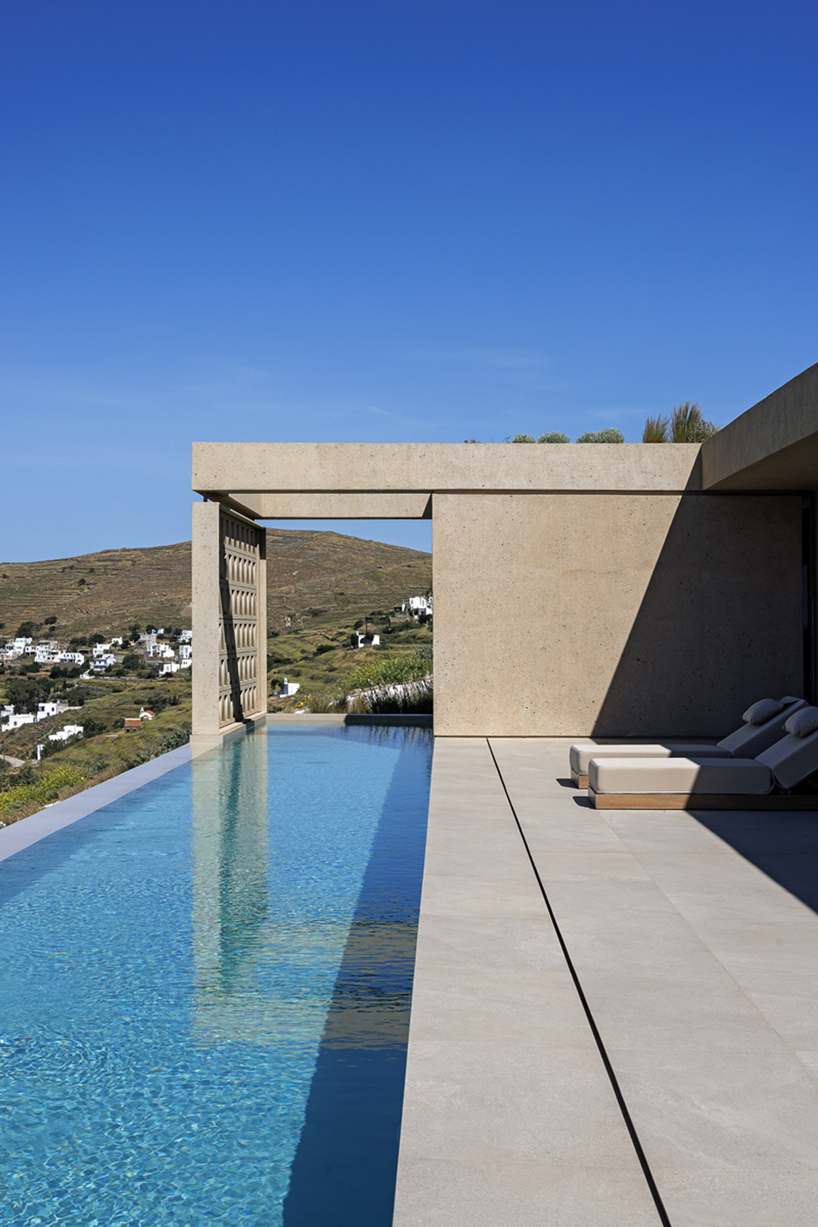 katerina valsamaki embeds subterranean house into hillside slot on tinos island, greece