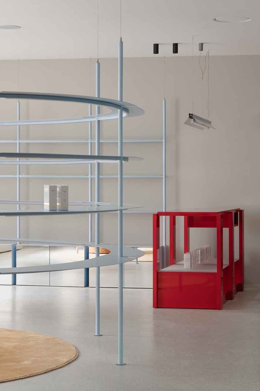 circular shelving units outline njoy sex shop's minimal interior in kyiv