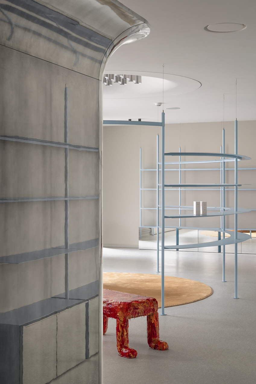 circular shelving units outline njoy sex shop's minimal interior in kyiv