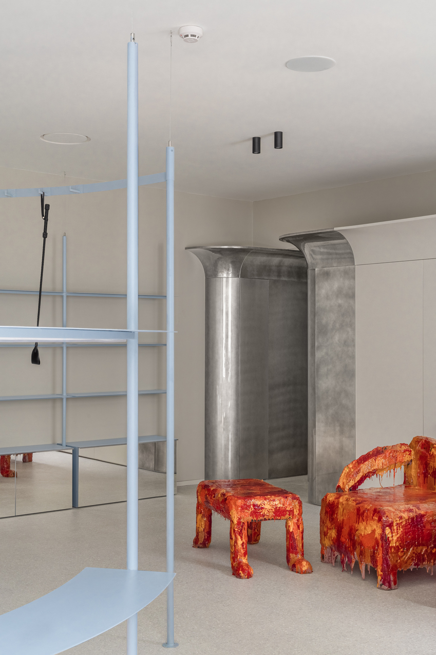 circular shelving units outline njoy sex shop's minimal interior in kyiv