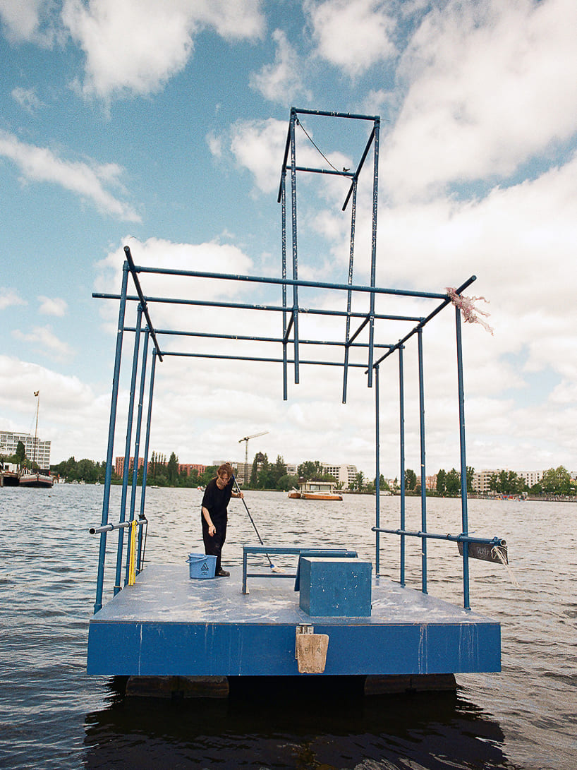 an endless act of cleaning unfolds on a floating platform in berlin - 3