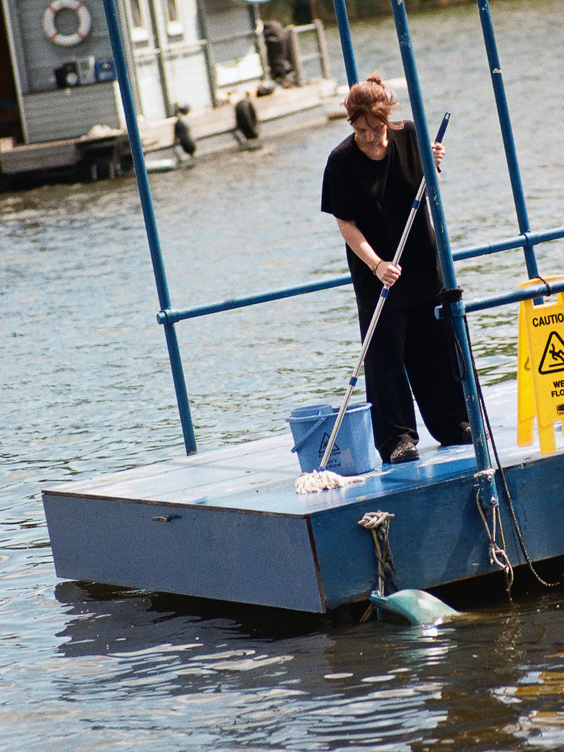 an endless act of cleaning unfolds on a floating platform in berlin - 4