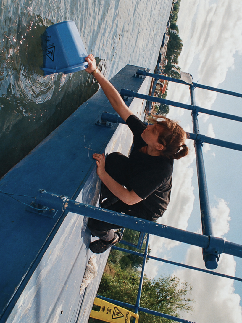 an endless act of cleaning unfolds on a floating platform in berlin - 7