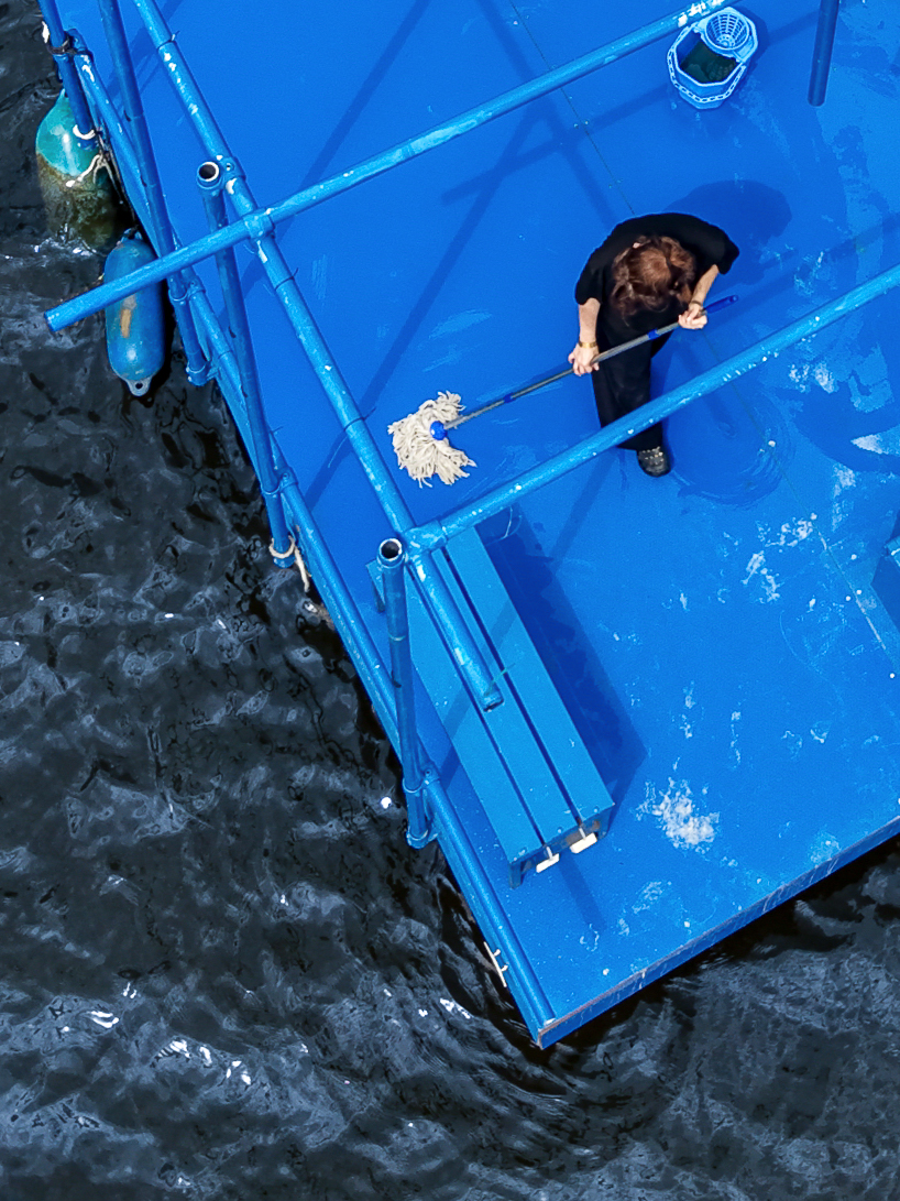 an endless act of cleaning unfolds on a floating platform in berlin - 8