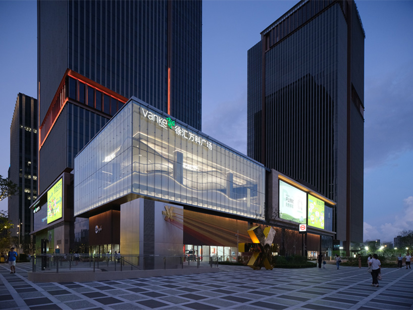 curved urban skatepark set within floating glass volume overlooks shanghai’s skyline