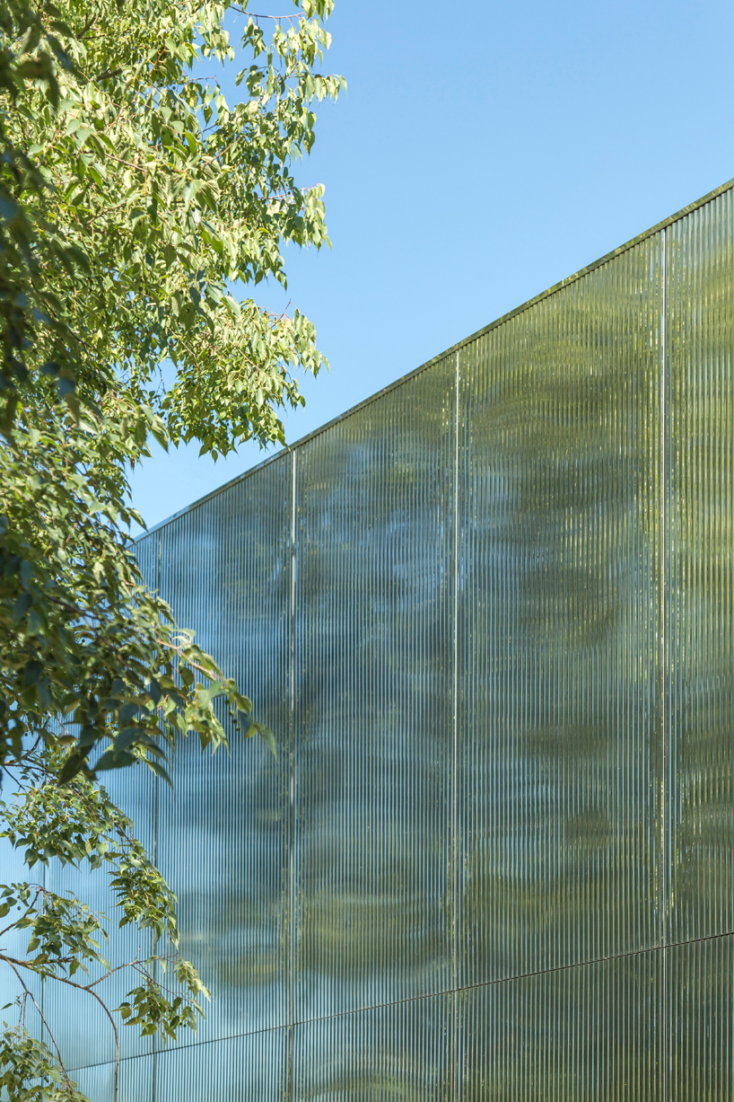 mirrored aluminum facade blurs distretto solidale social space into the italian landscape - 6