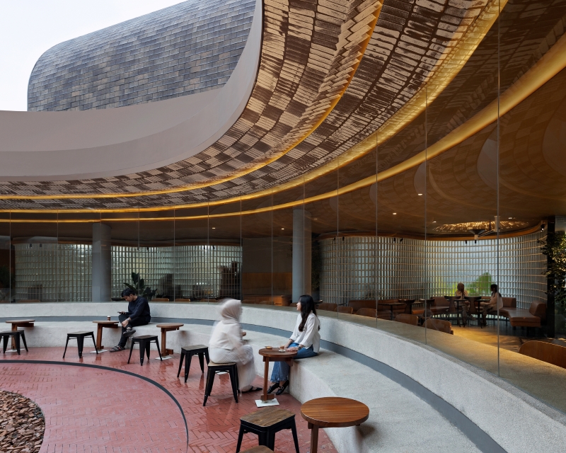 four arched shelters by RAD+ar expand upon layered sloped garden in north jakarta