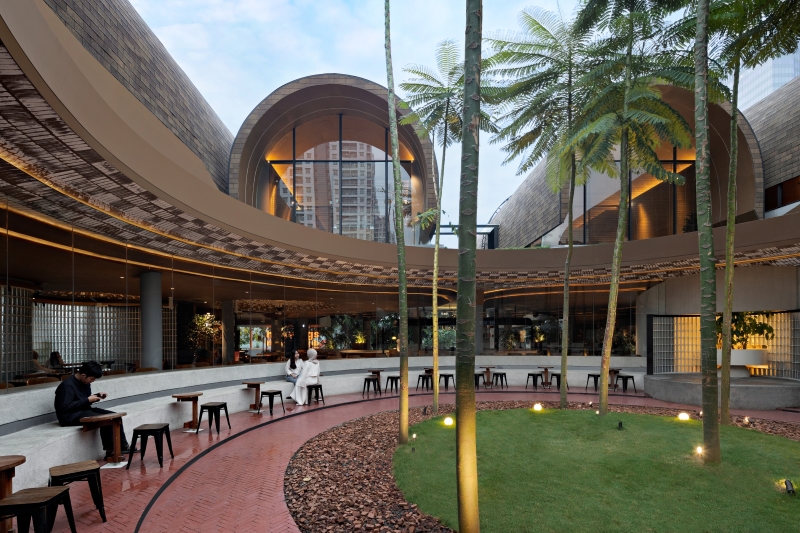 four arched shelters by RAD+ar expand upon layered sloped garden in north jakarta