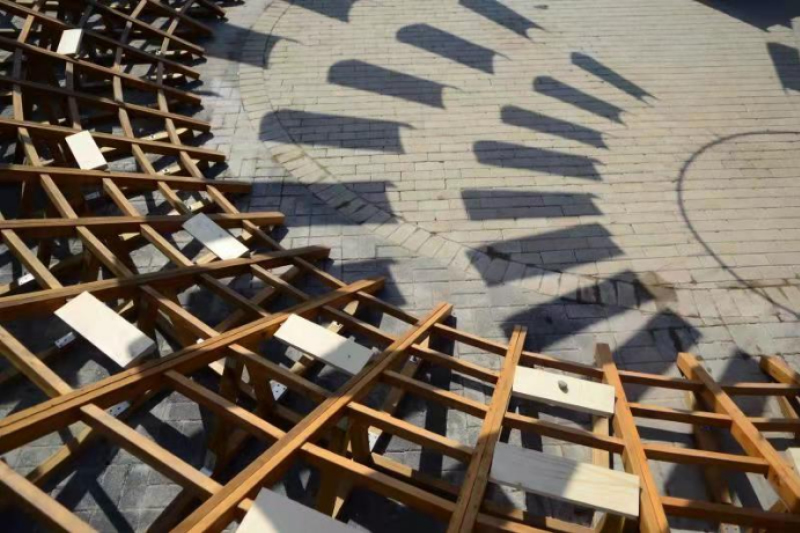 ladders turn into circular framework for climbing amphitheater in rural chinese town