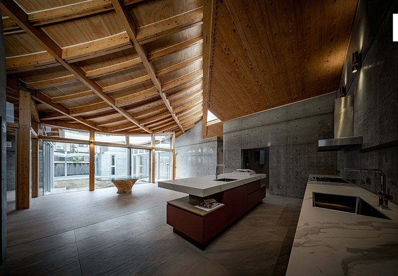 hyperbolic roof composed of curved timber slats tops concrete residence in taiwan