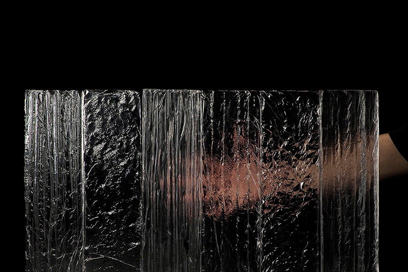 textured glass skin forms into curved roof for cossement cardoso's helsinki museum concept